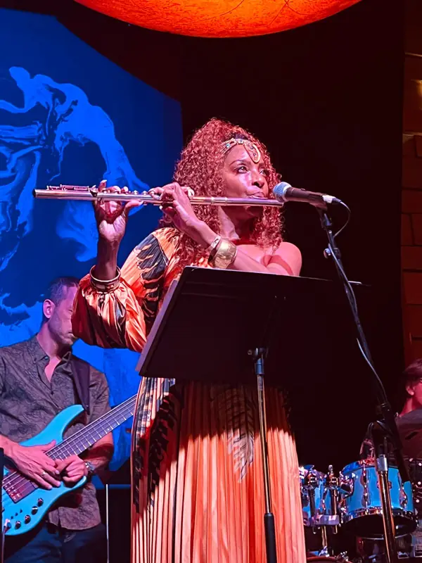 Kandace Lindsey playing flute on stage