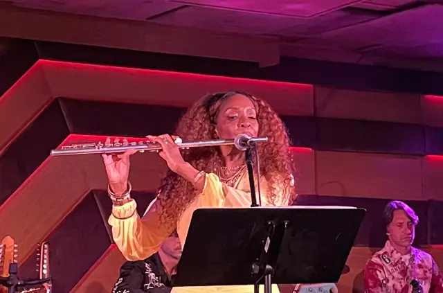 Kandace Lindsey playing flute with the band